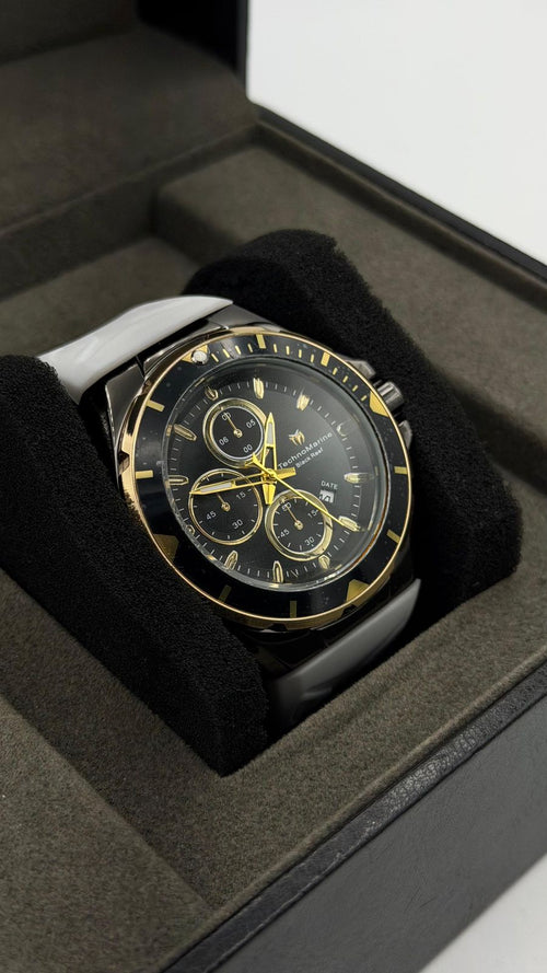 TM OCEAN TABLERO NEGRO DETALLES DORADOS /PULSERA BLANCA