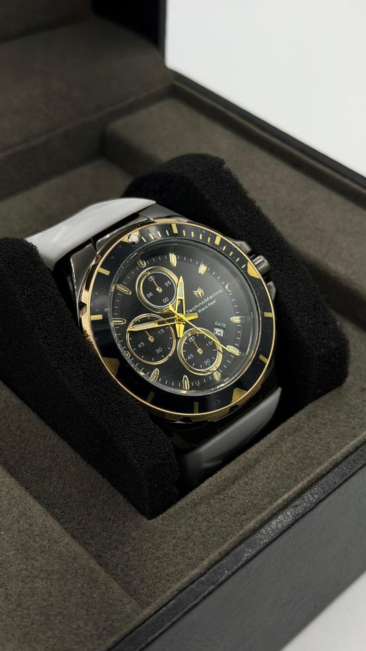 TM OCEAN TABLERO NEGRO DETALLES DORADOS /PULSERA BLANCA